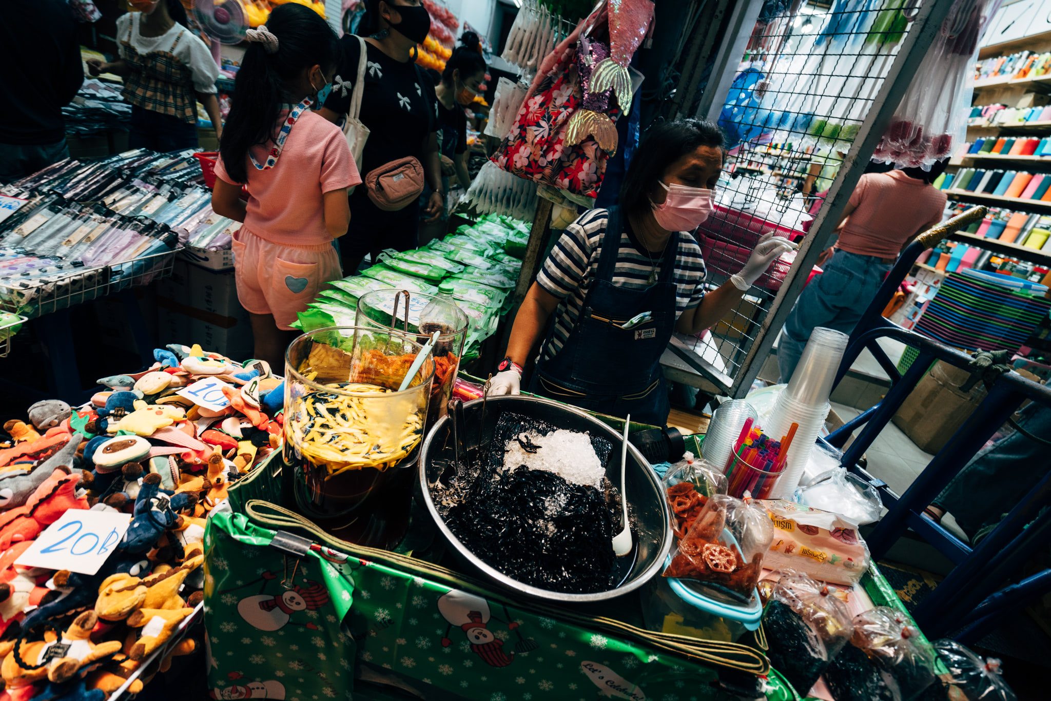 Thai street food vendor selling drinks and snacks.