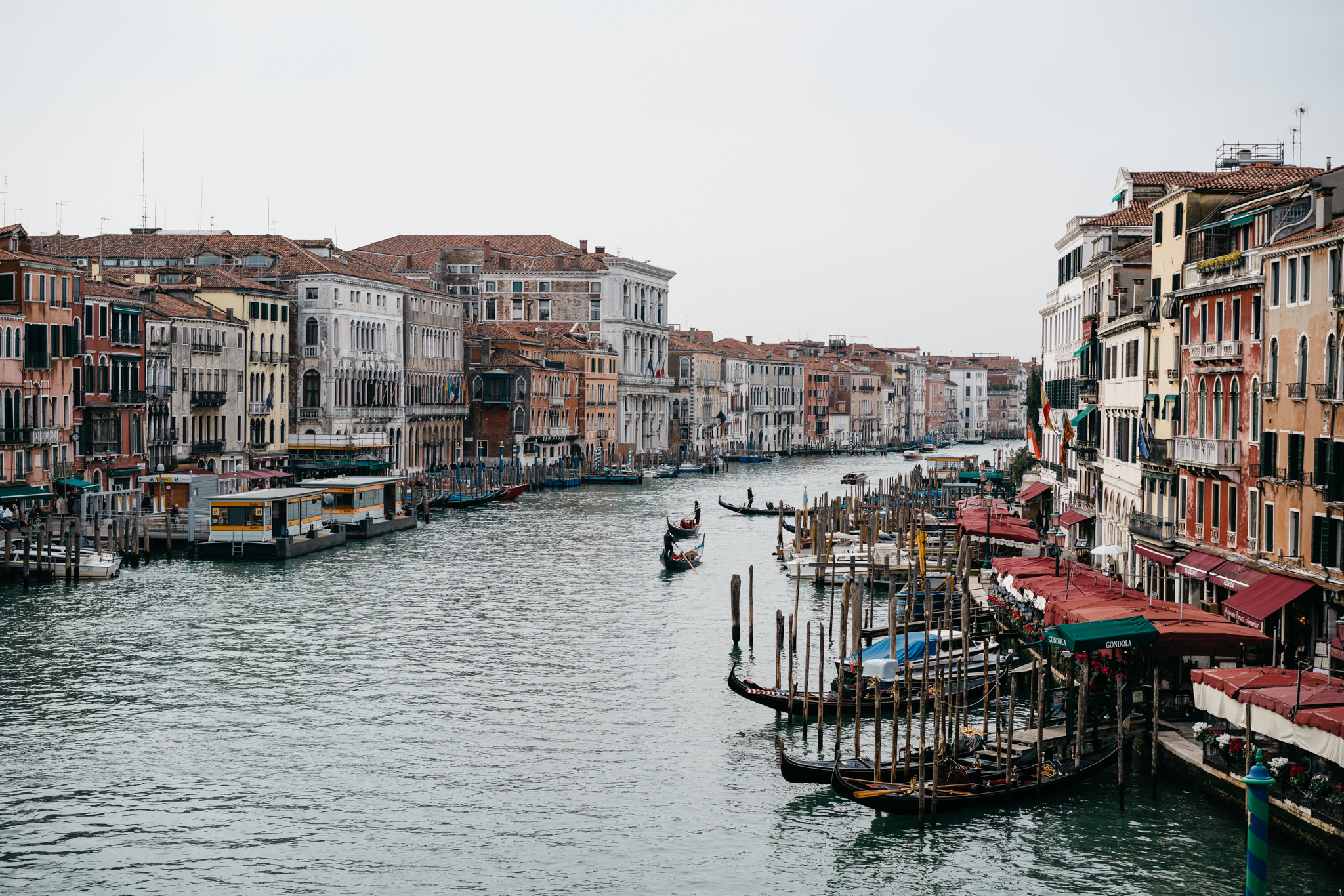 Grand Canal in Venice, Italy, with gondolas and colorful buildings.