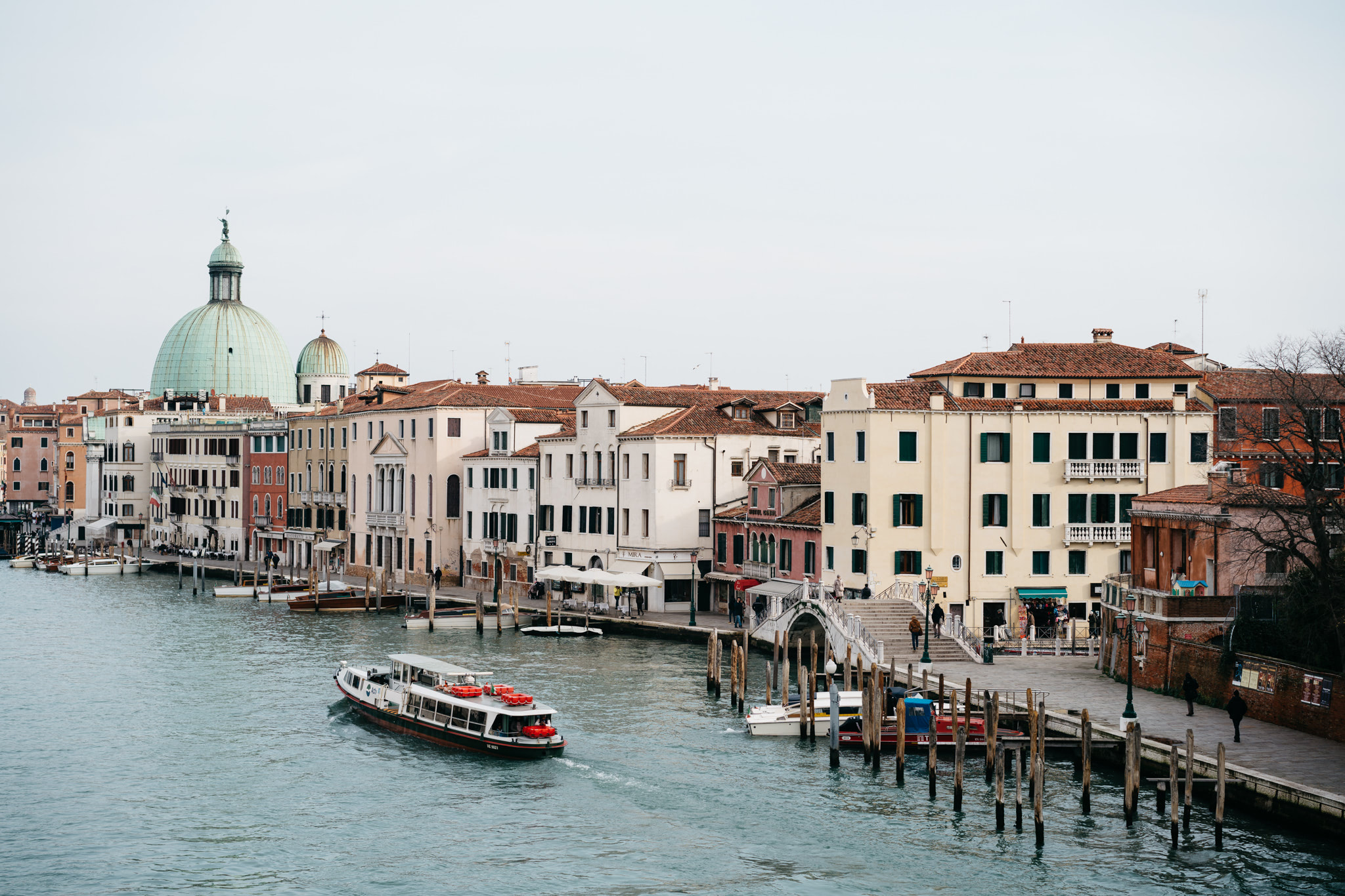 Venice canal with boat and buildings.