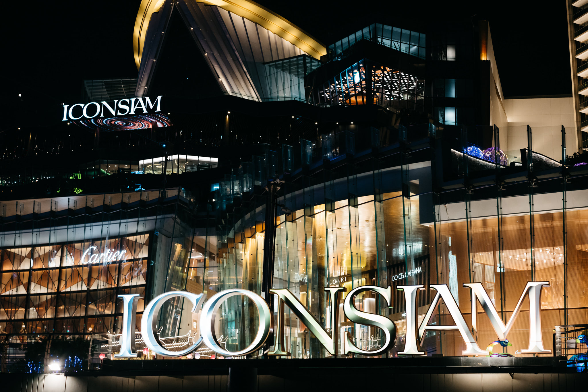 Iconsiam Bangkok at night; large illuminated signage.