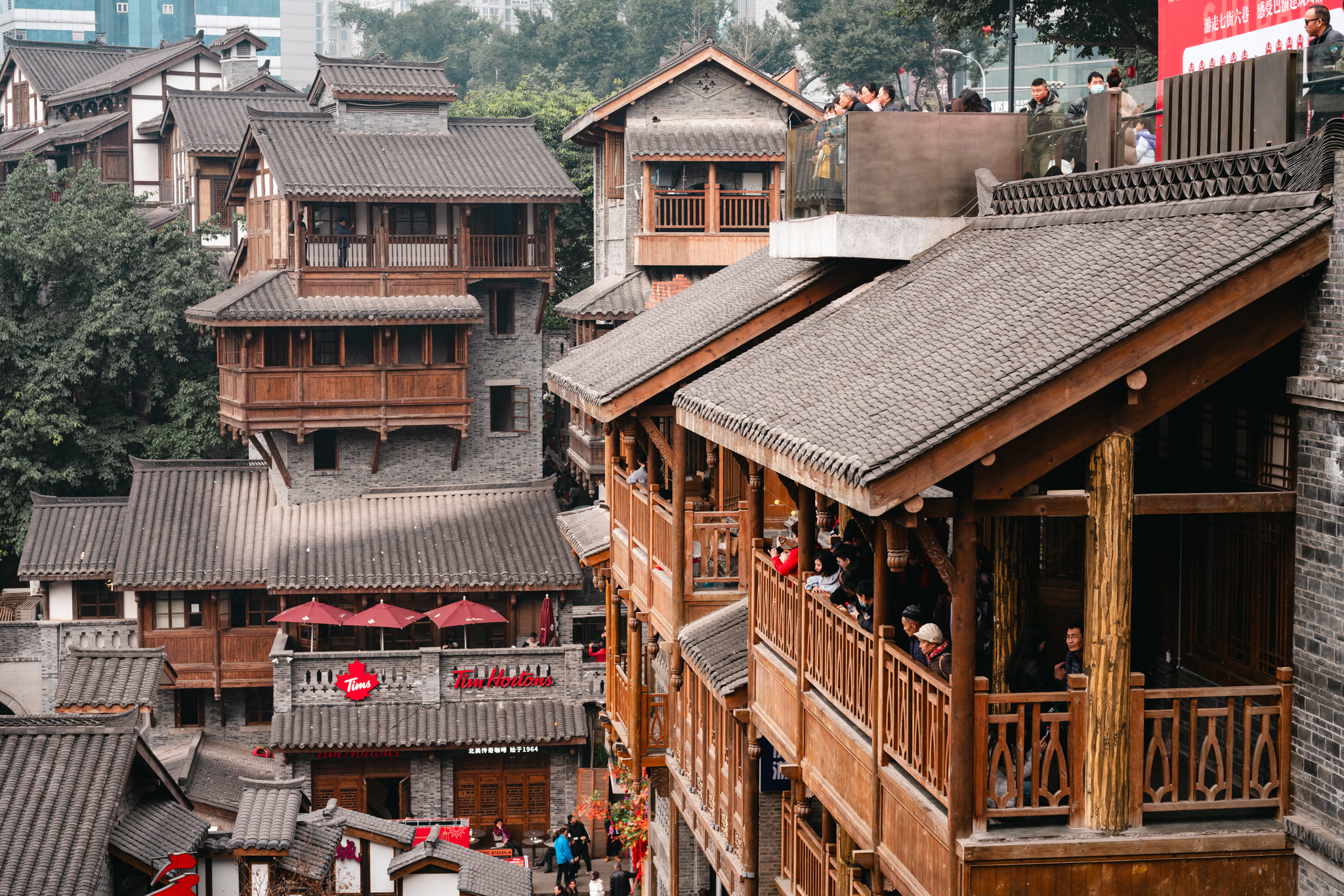 Chongqing Ciqikou, traditional Chinese buildings with people on balconies.