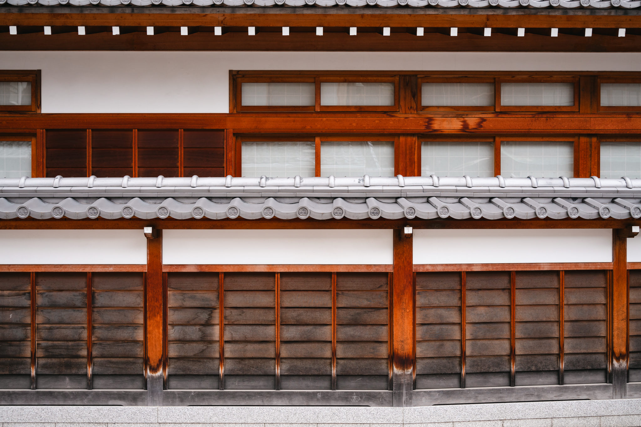 Miyajima building exterior with wood and tile details.