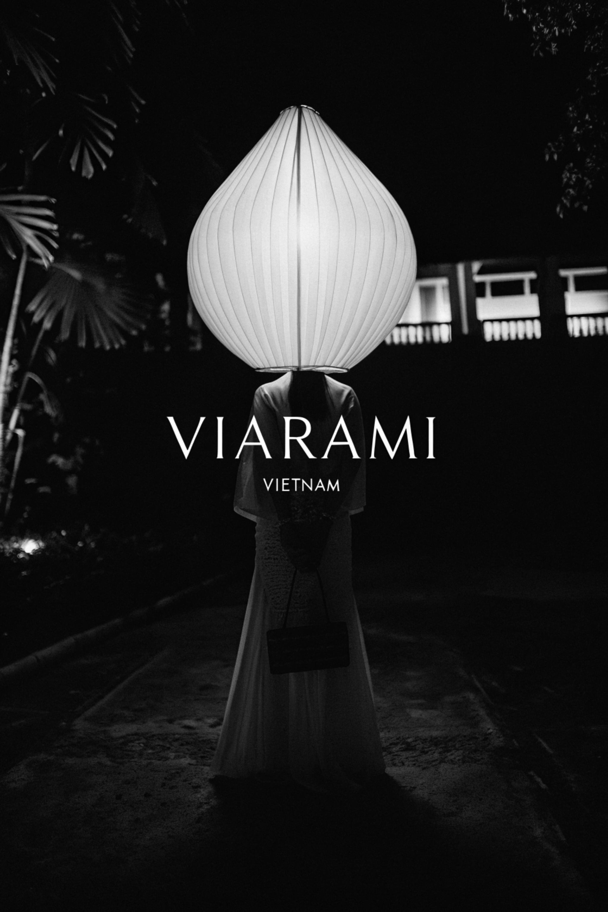 Person with a lantern over their head in Vietnam.