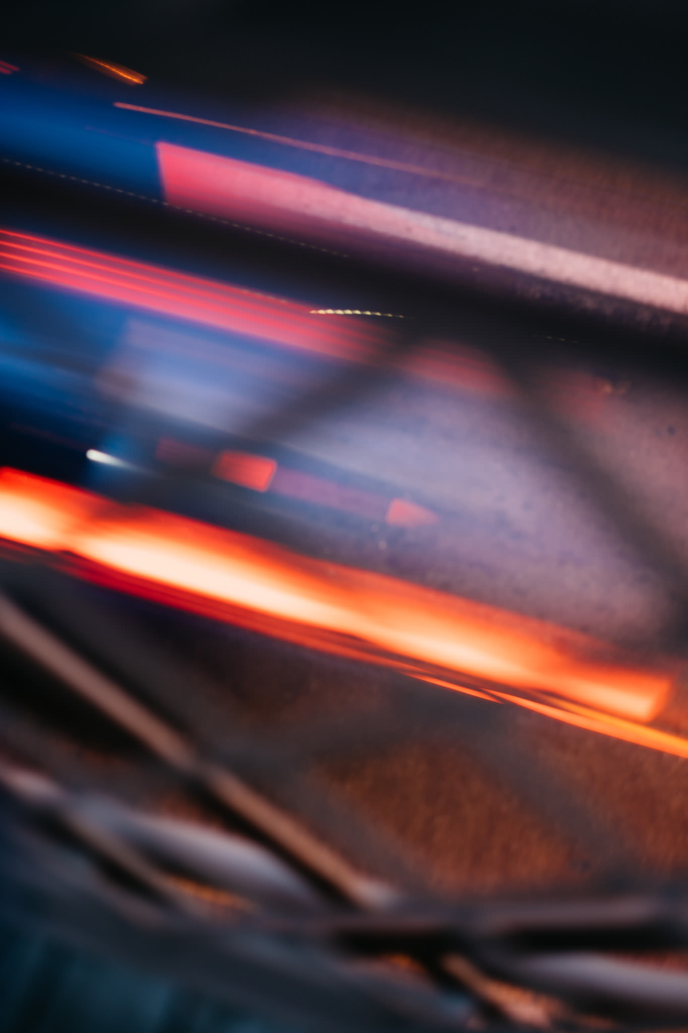 Abstract motion blur with streaks of red and blue light on a dark background