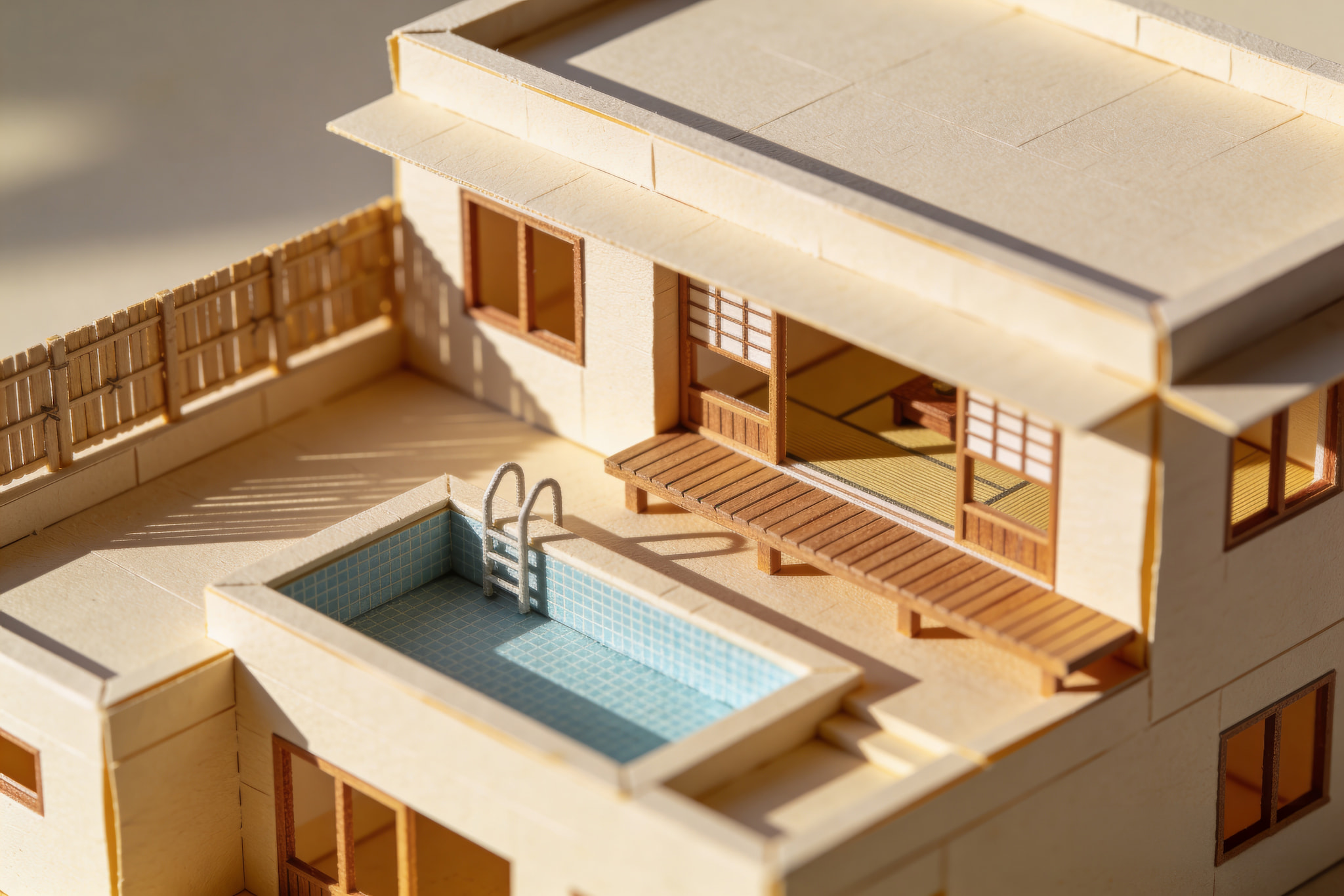 Architectural model of a modern house with a rooftop swimming pool and wooden deck