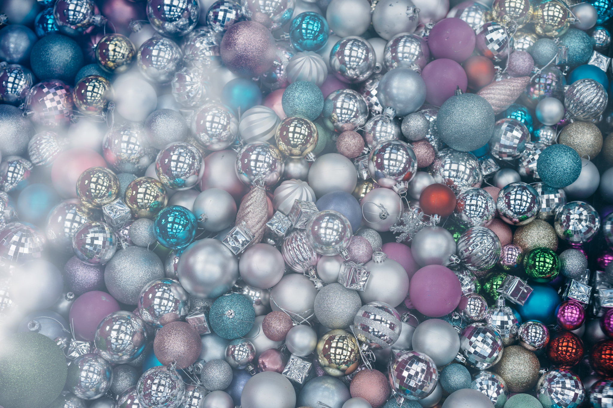 Pile of assorted colorful Christmas ornaments