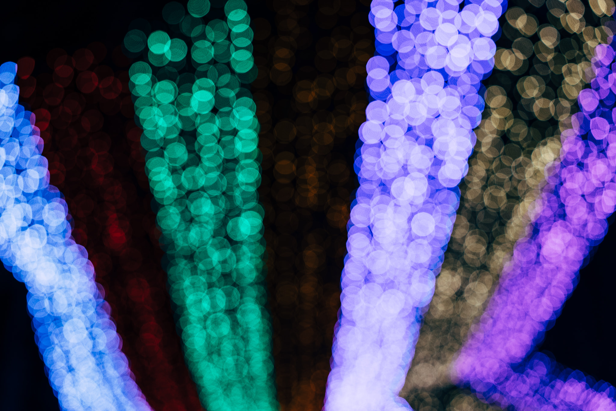 Abstract colorful bokeh lights in vertical streaks