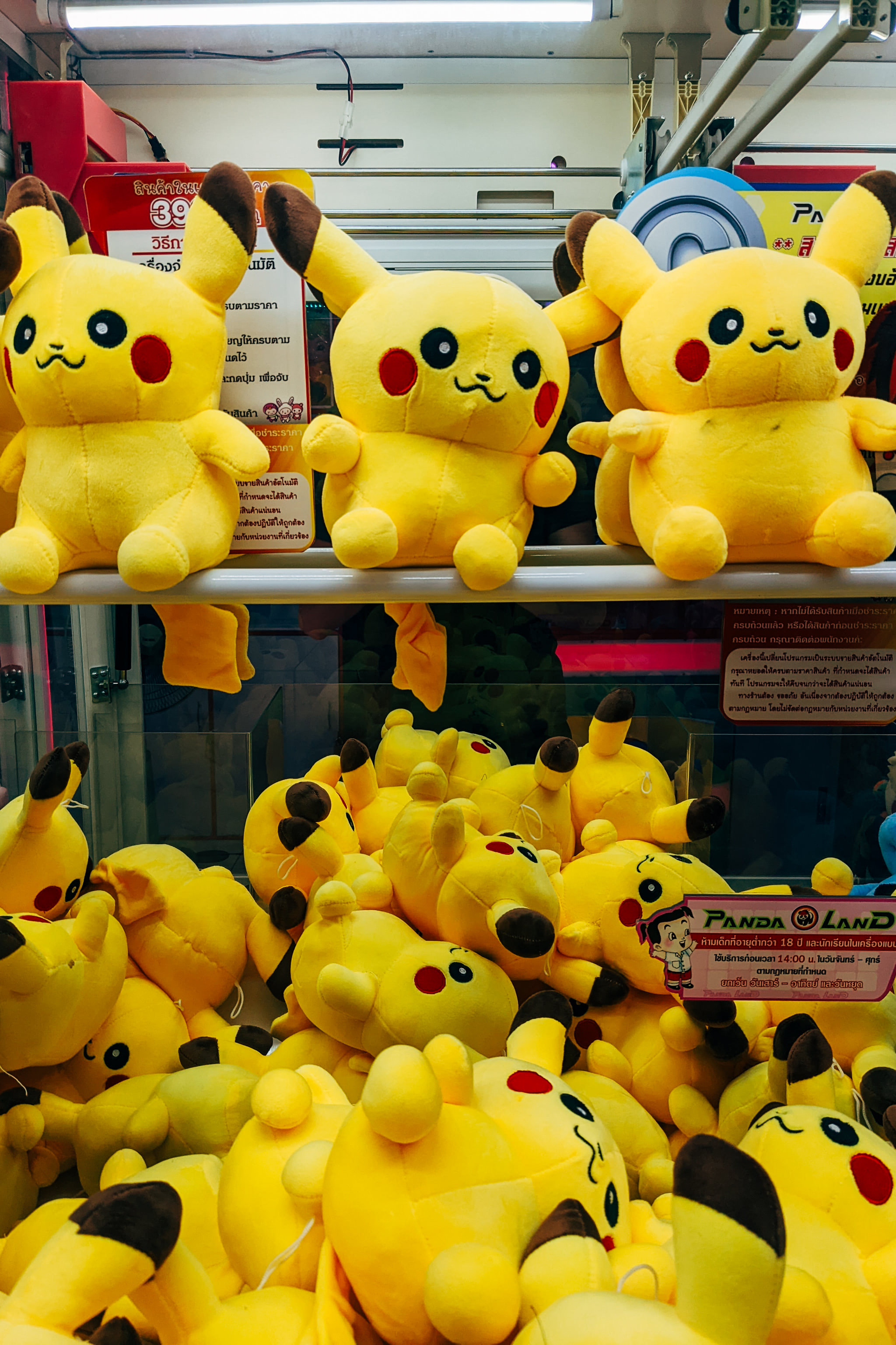 Pikachu plush toys displayed in claw machine