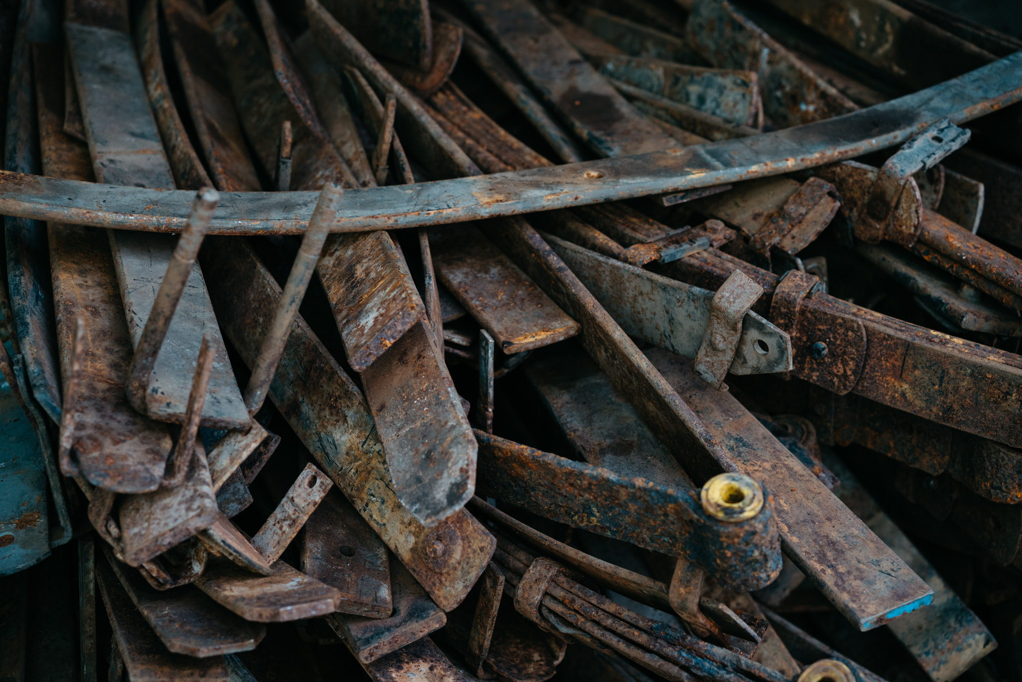 Pile of rusted scrap metal and discarded steel parts