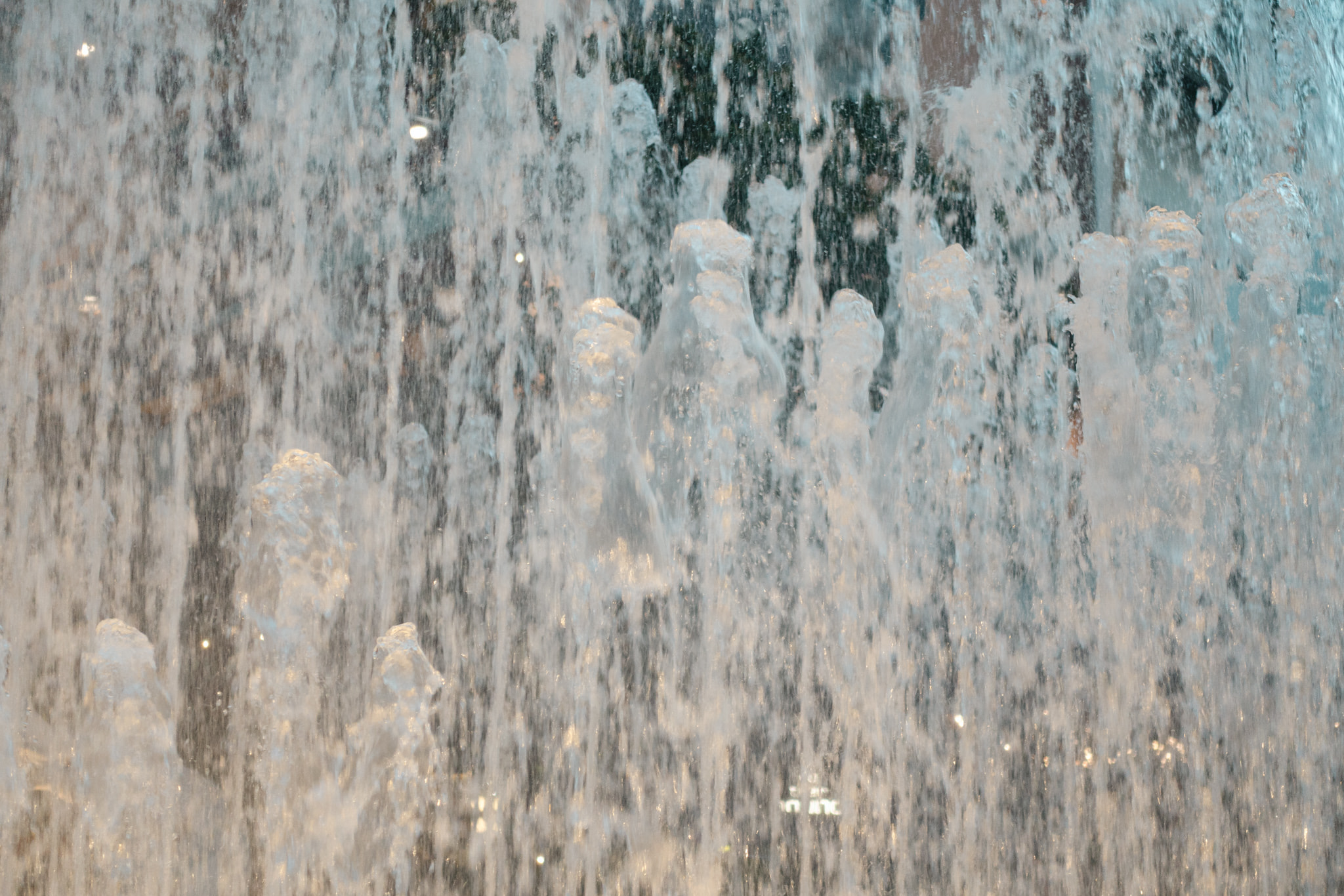 Close-up of water fountain jets with cascading streams