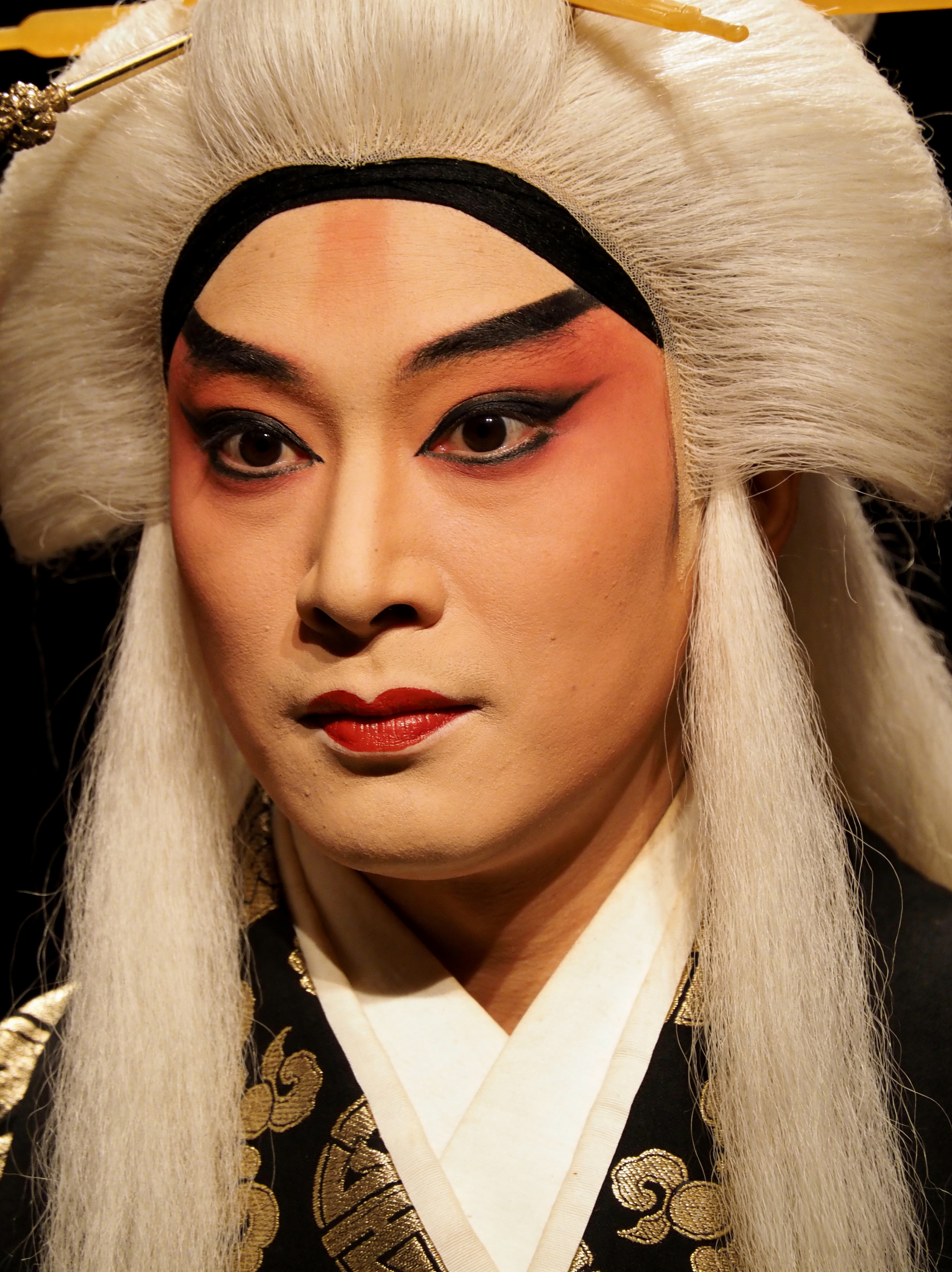 Close-up of a performer in traditional Chinese opera makeup and costume